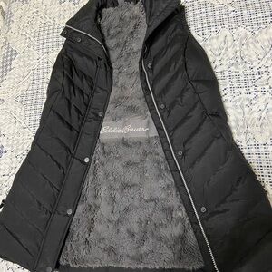 Eddie Bauer Women's Black Puffer parka vest with faux fur lining.